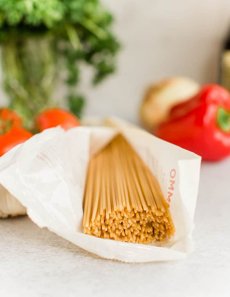Open package of rummo italian spaghetti coming out of package from magnifico foods