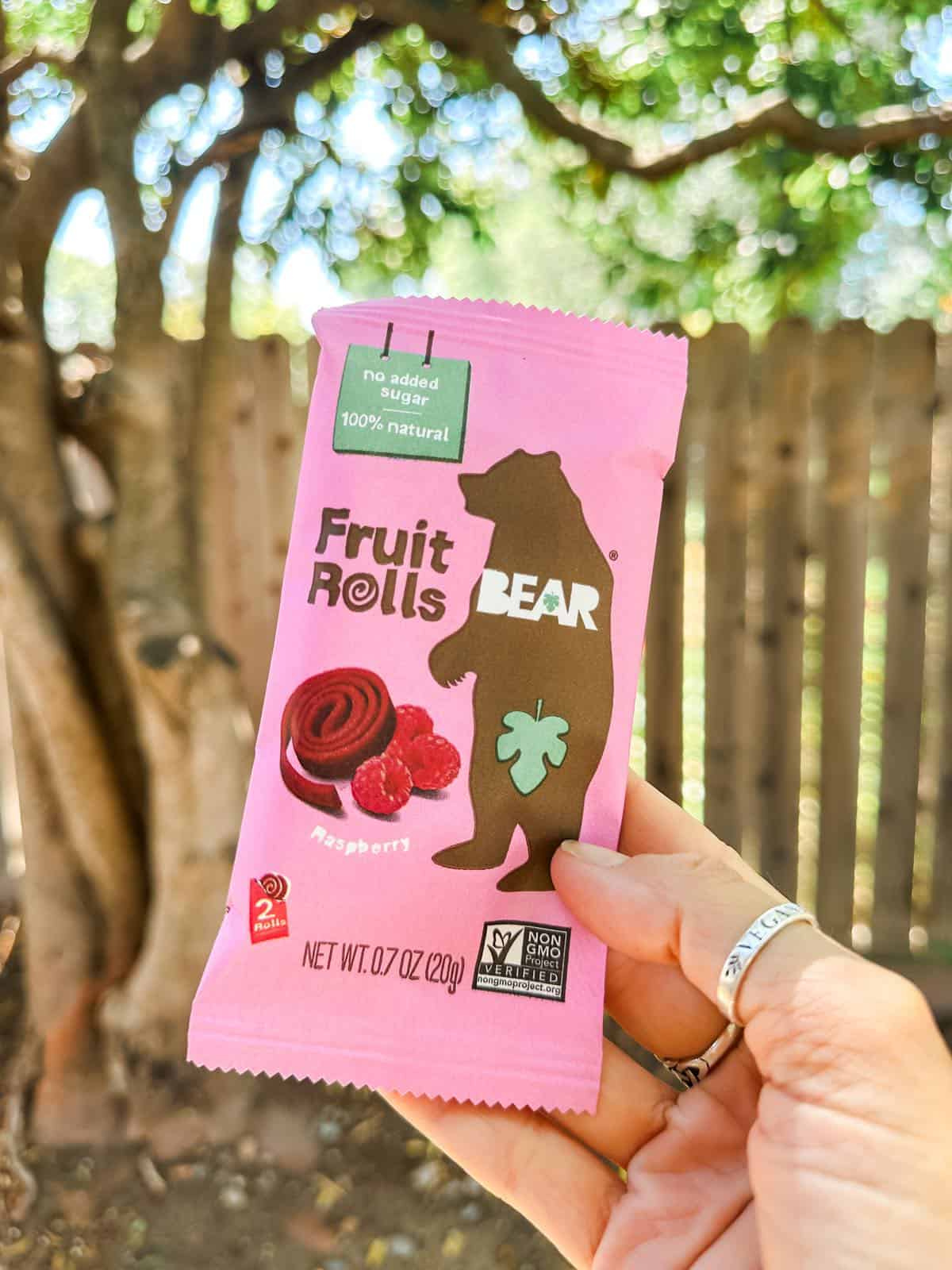 A pink package of Bear brand all natural fruit rolls for kids snacks and lunchboxes. 