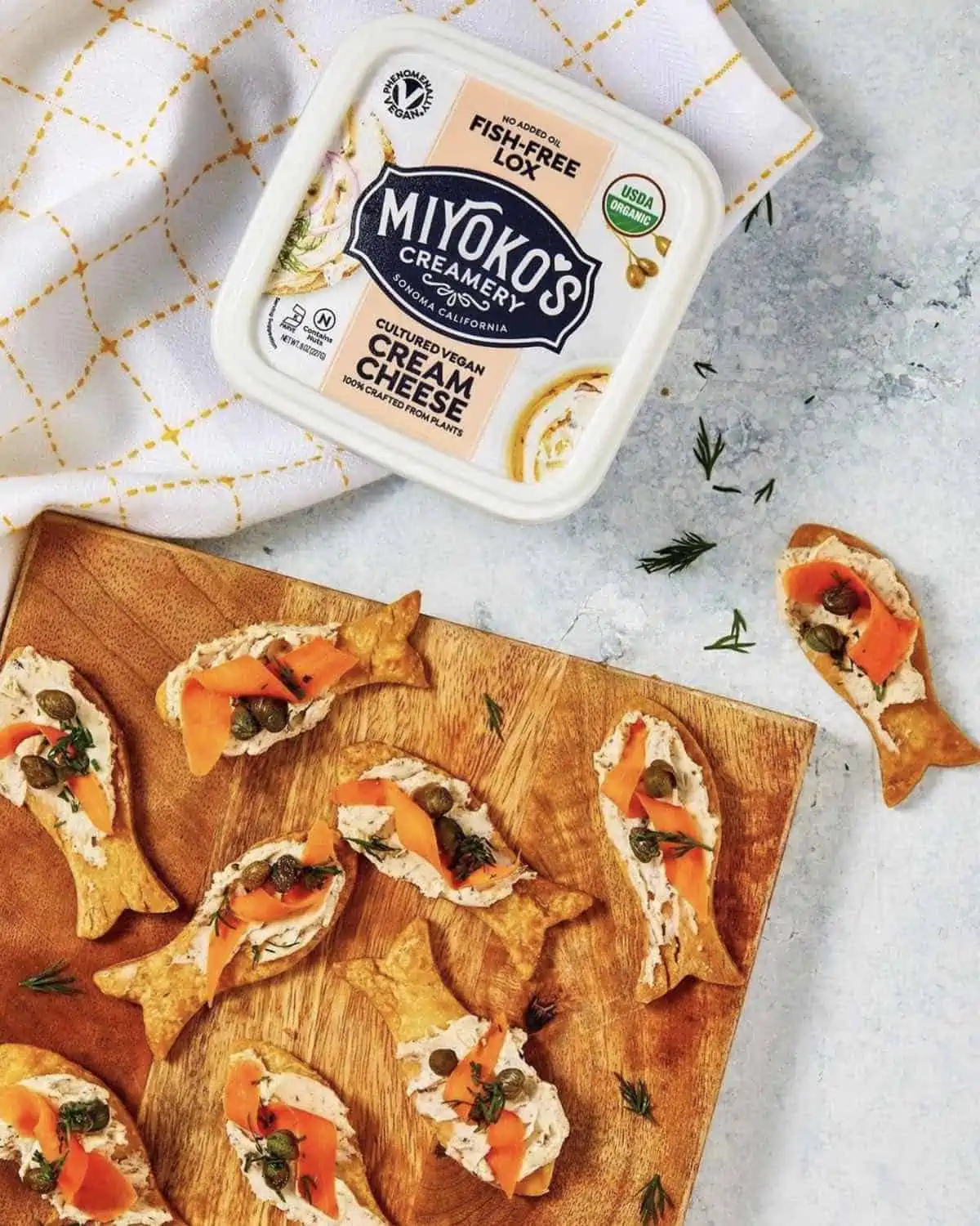 miyokos fish free lox cream cheese served on cute fish crackers as an appetizer