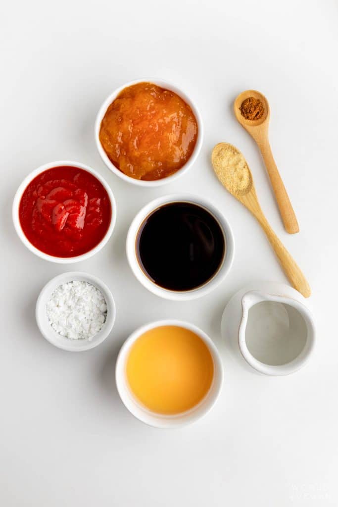 sweet and sour sauce ingredients flatlay with ketchup jam soy sauce and more