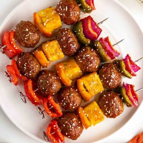 vegan kabob skewers with veggies and sweet and sour sauce