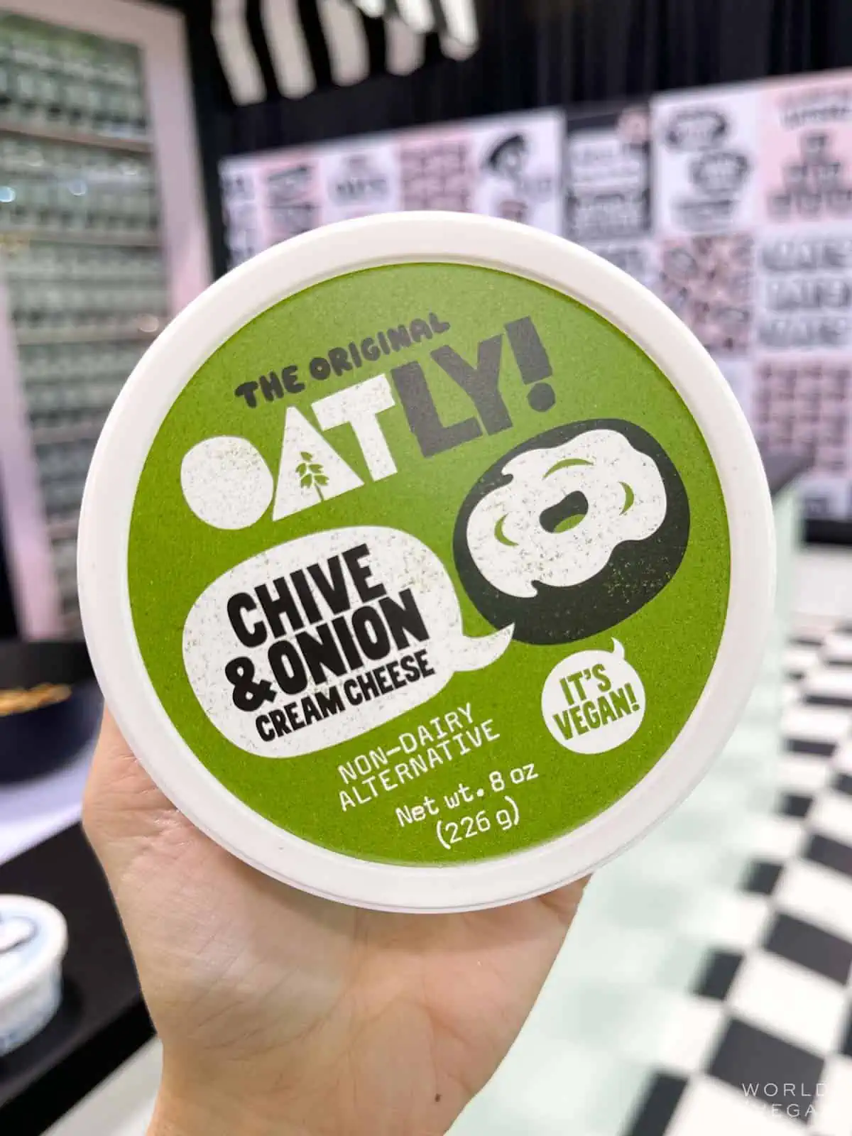 A tub of Oatly vegan cream cheese spread.