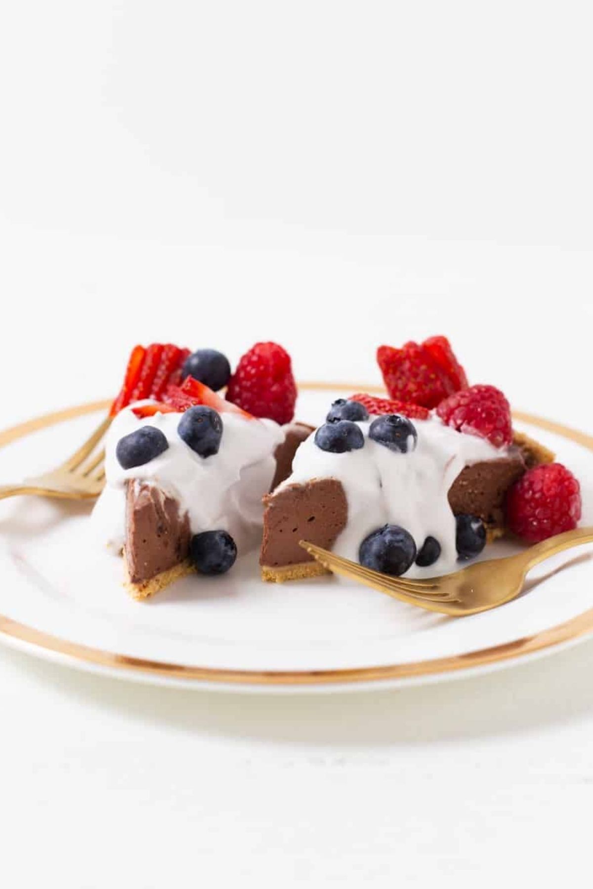 No-bake vegan chocolate pie with fresh berries on a plate.
