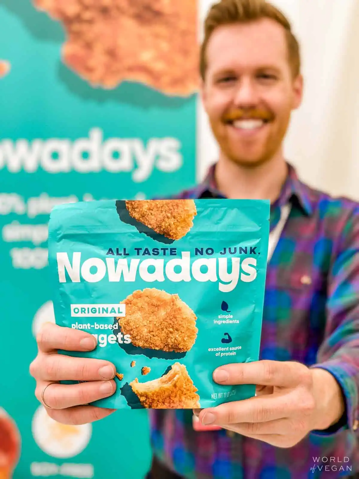A person holding a bag of Nowadays plant-based chicken nuggets.