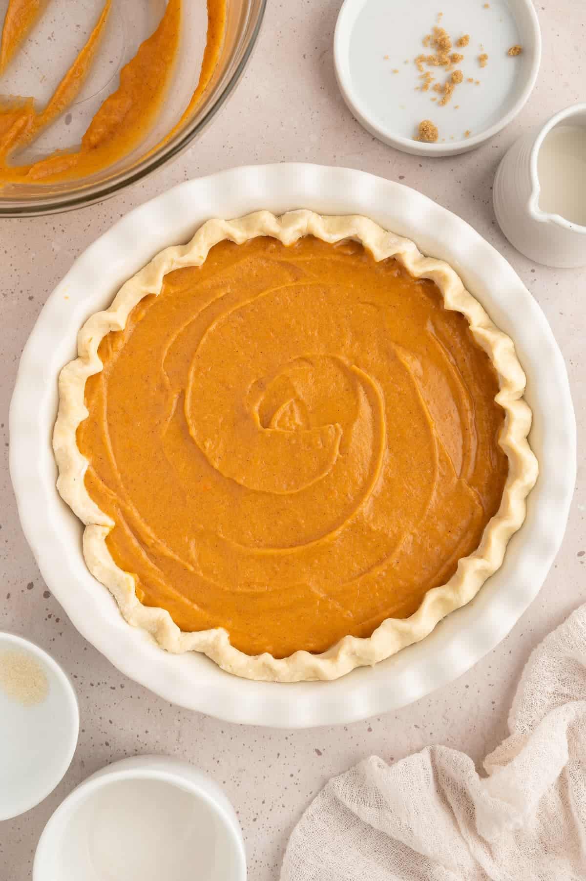 Prepared sweet potato pie in baking dishing before baking.