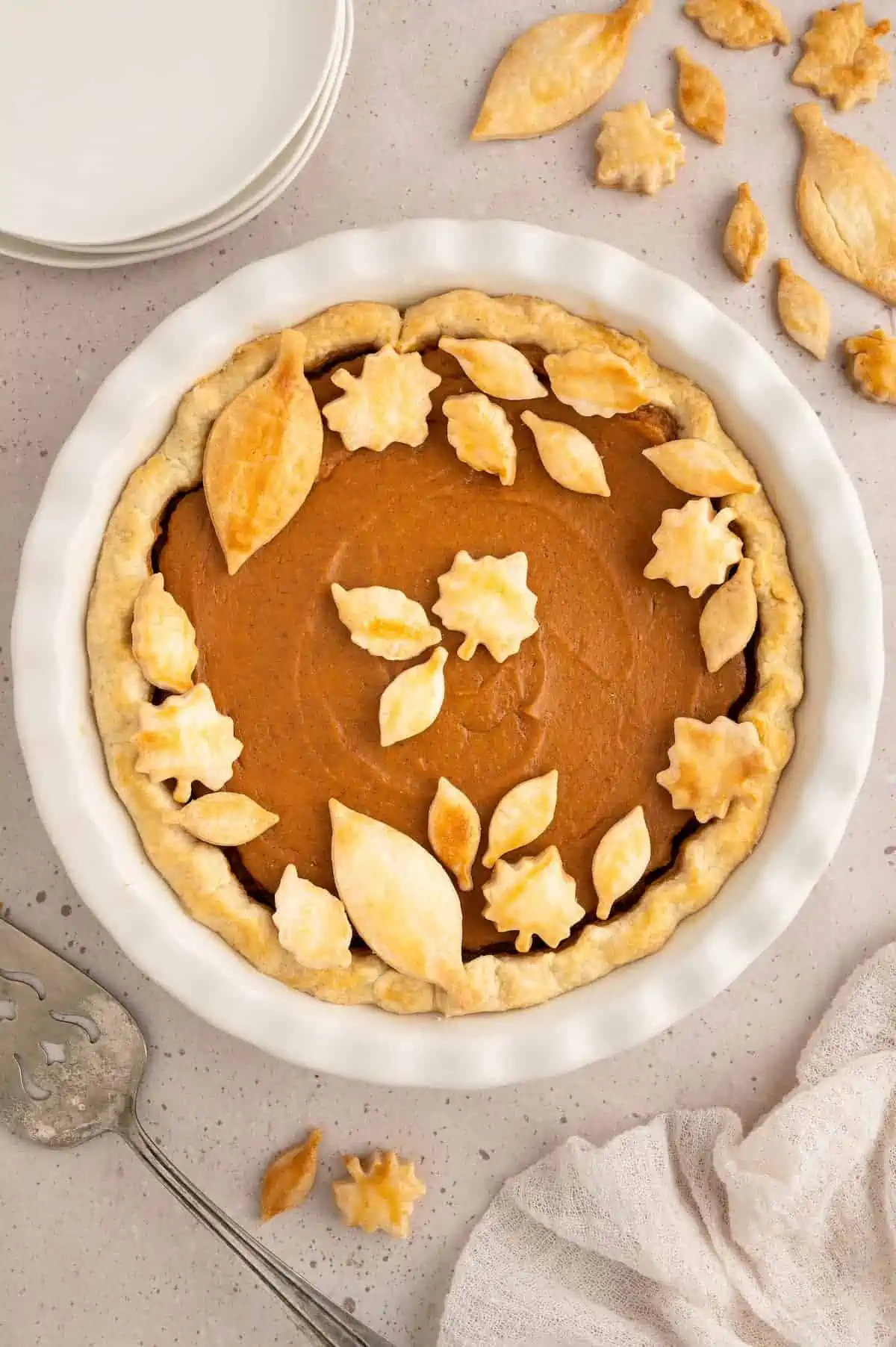 Vegan sweet potato pie after baking and decorated with pastry leaves.