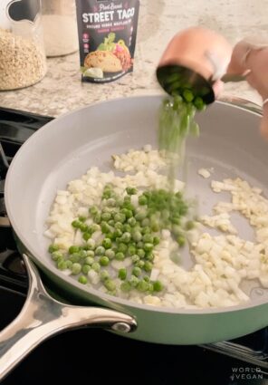 Sauteeing onions and frozen peas in a Caraway saute pan.