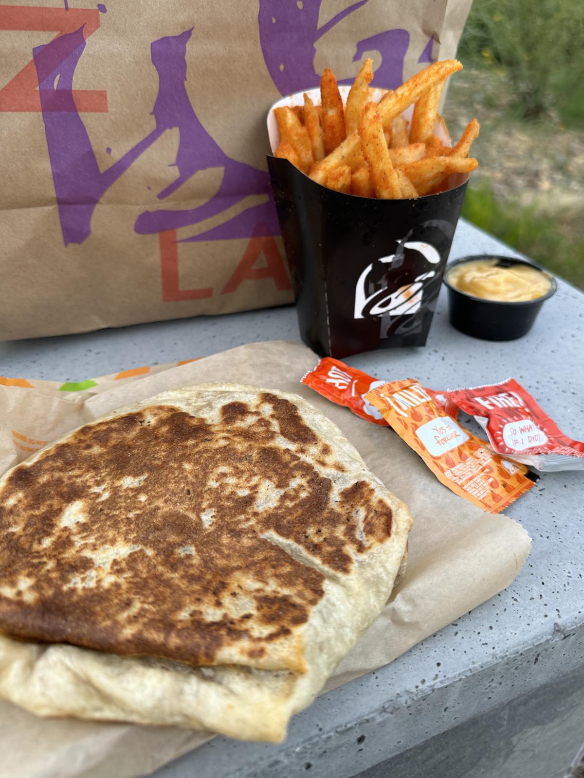 A vegan order from Taco Bell with a crunch wrap supreme and nacho cheese fries
