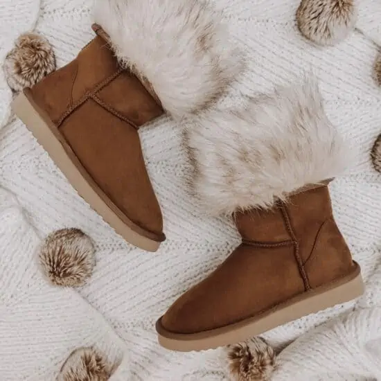 vegan ugg boots from pawj on a blanket with holiday decorations