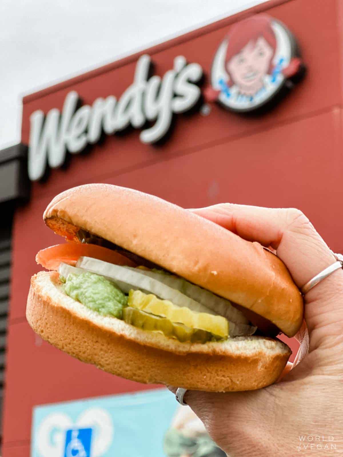 Modified vegan veggie burger at Wendy's that's just a bun, lettuce, tomato, onion, pickles, and avocado.