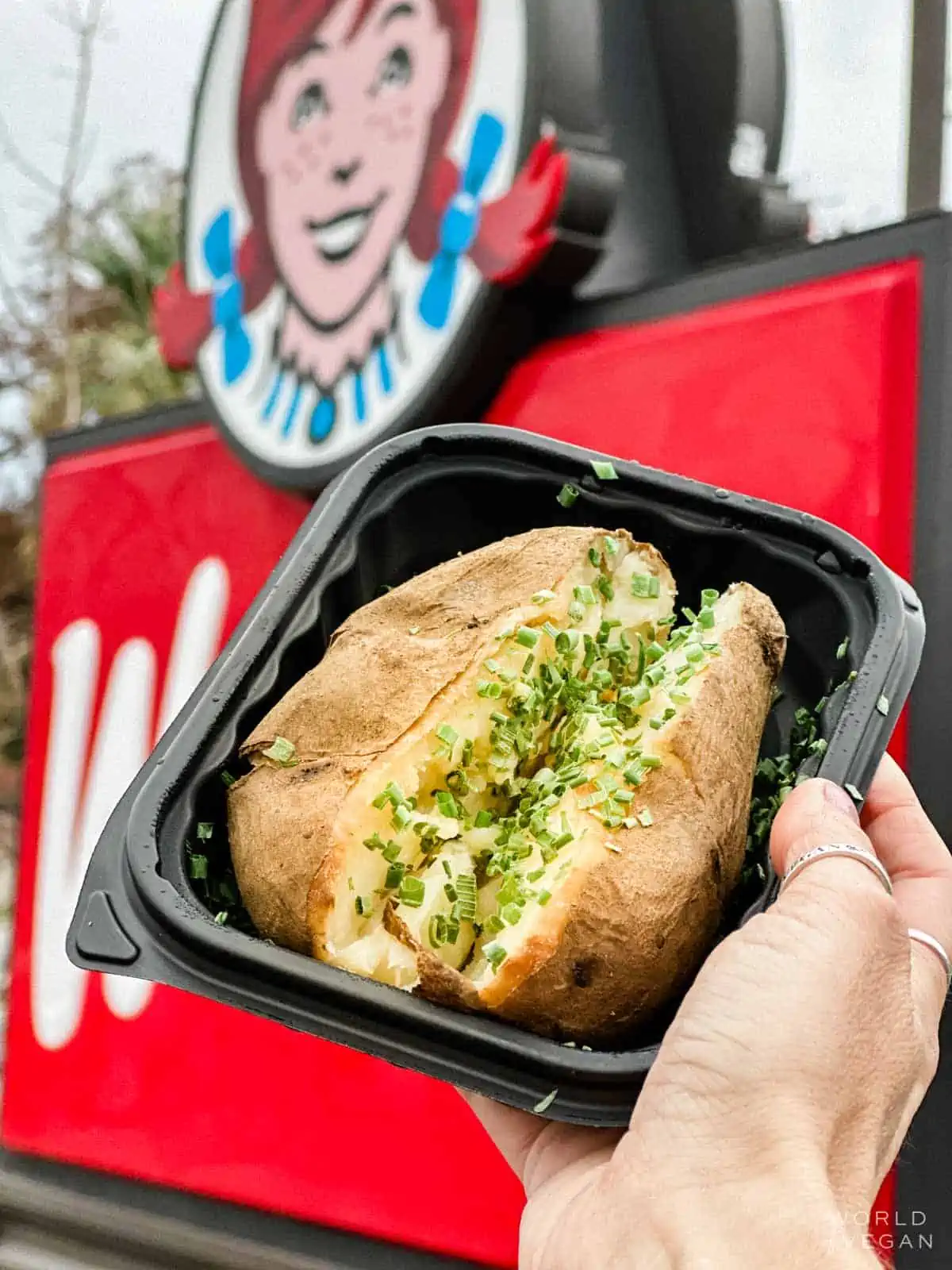 Plain baked potato with chives ordered vegan at Wendy's fast food restaurant.