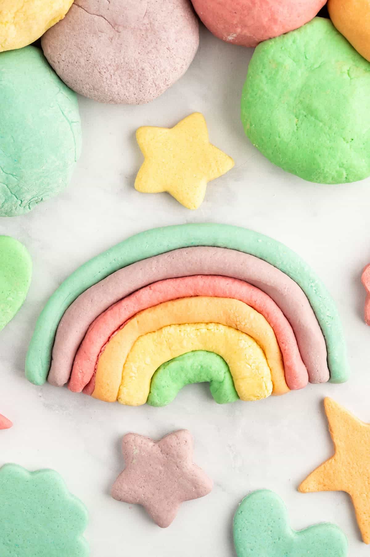 Homemade play dough recipe made into a rainbow.