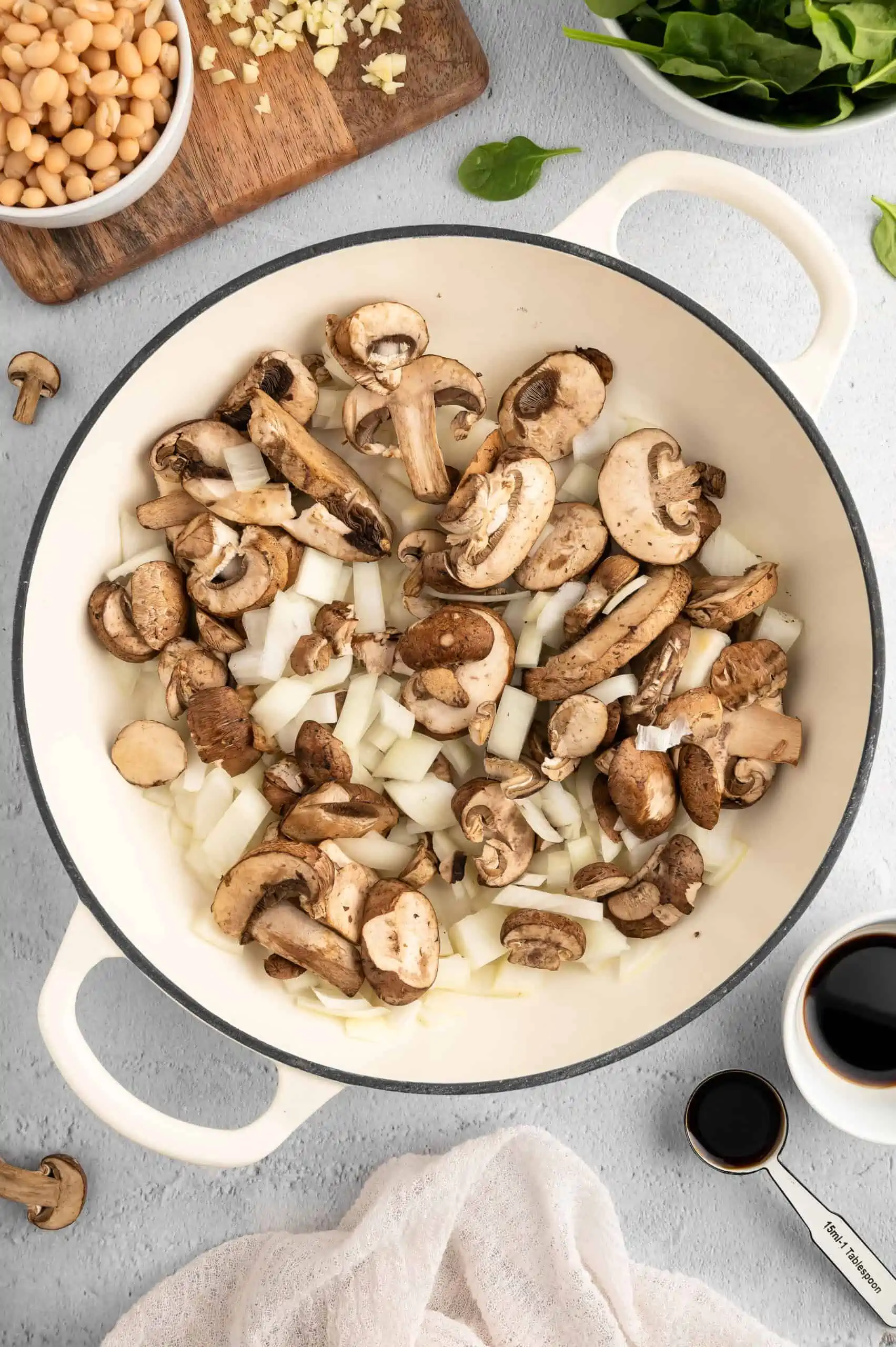 A pot with mushrooms and onions.