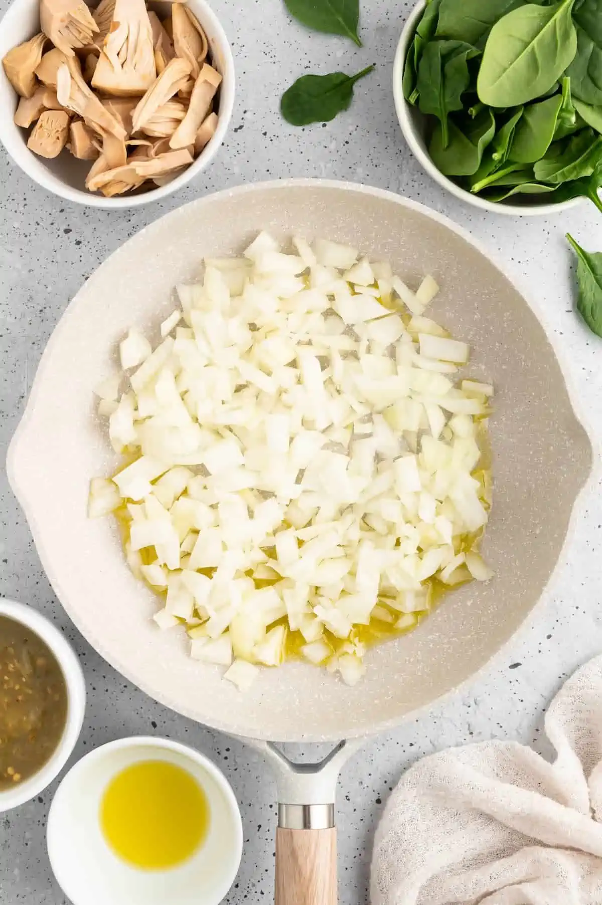 Onions simmering in a pan.