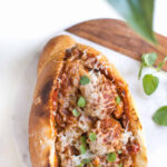 Vegan meatball subs with pasta sauce, vegetarian meatballs, and dairy-free cheese.
