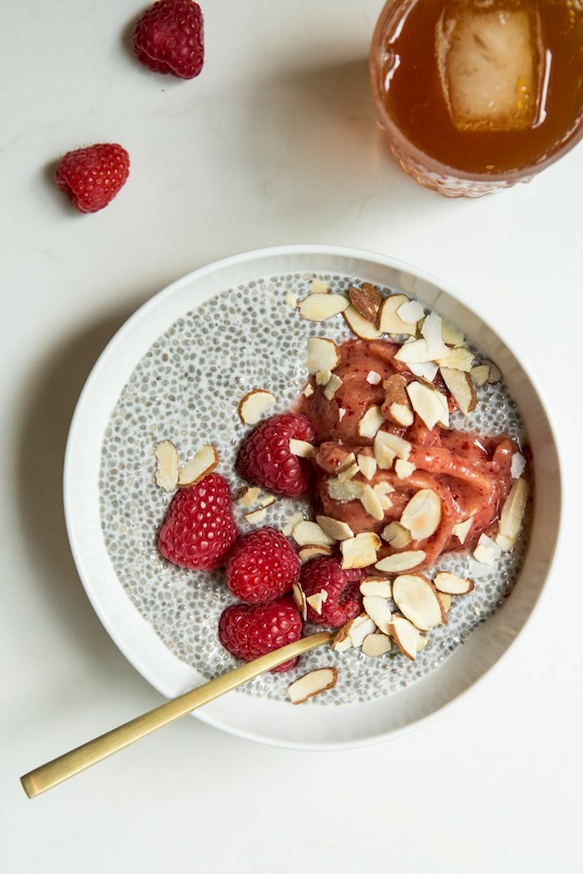 A bowl of basic chia seed pudding with fruit in a bowl.