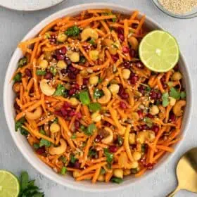 A Moroccan carrot salad in a large white serving bowl.