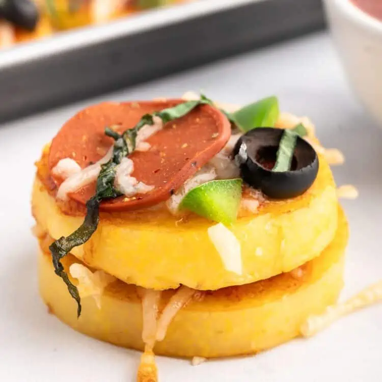 A close up shot of a polenta pizza bite.