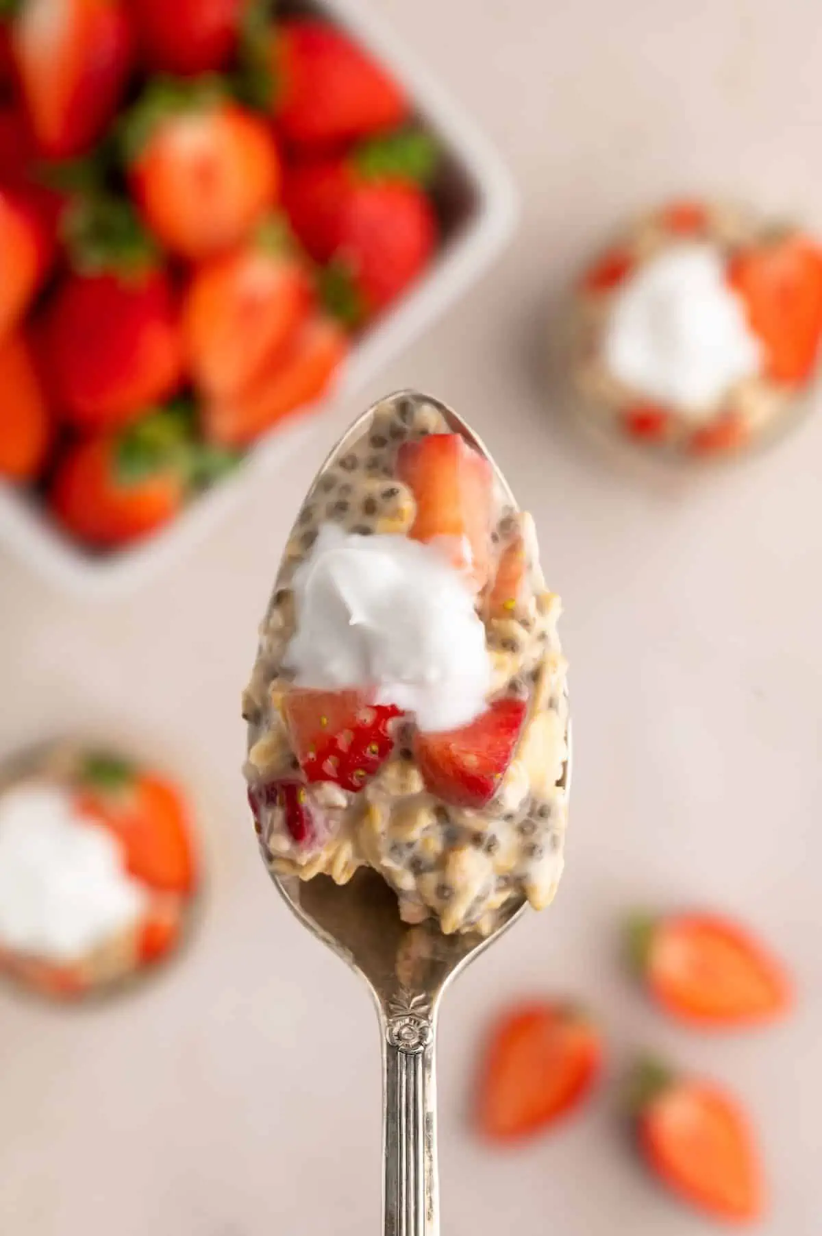 A spoonful of strawberries and cream overnight oats.