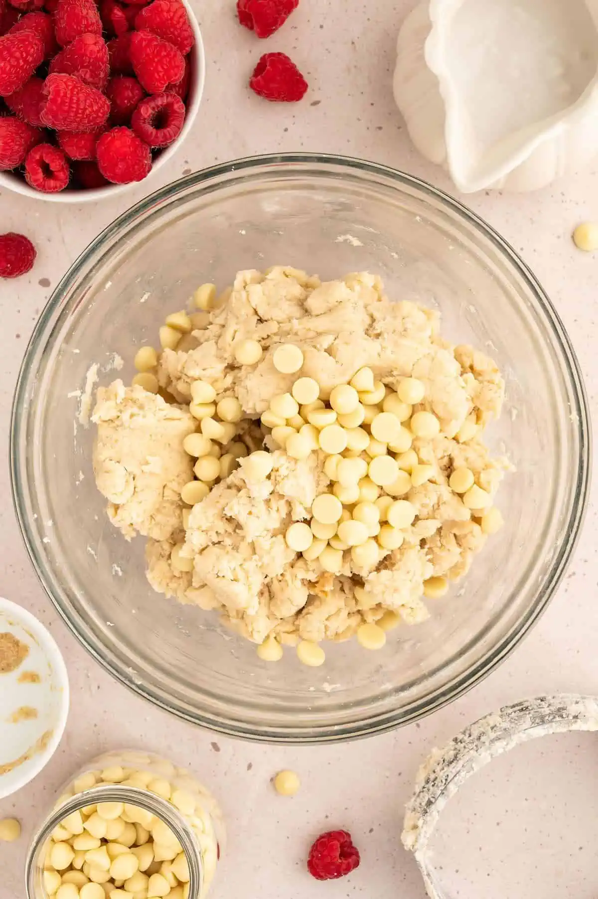 Vegan scone dough, with white chocolate chips on top.