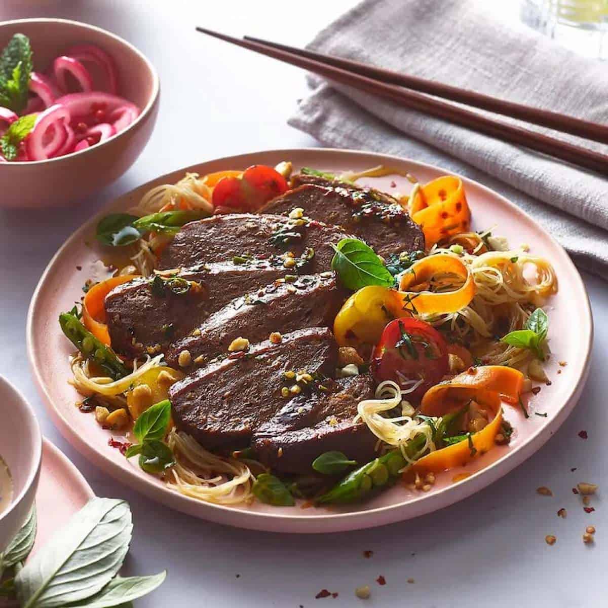 Vegan Thai beef salad on a plate.