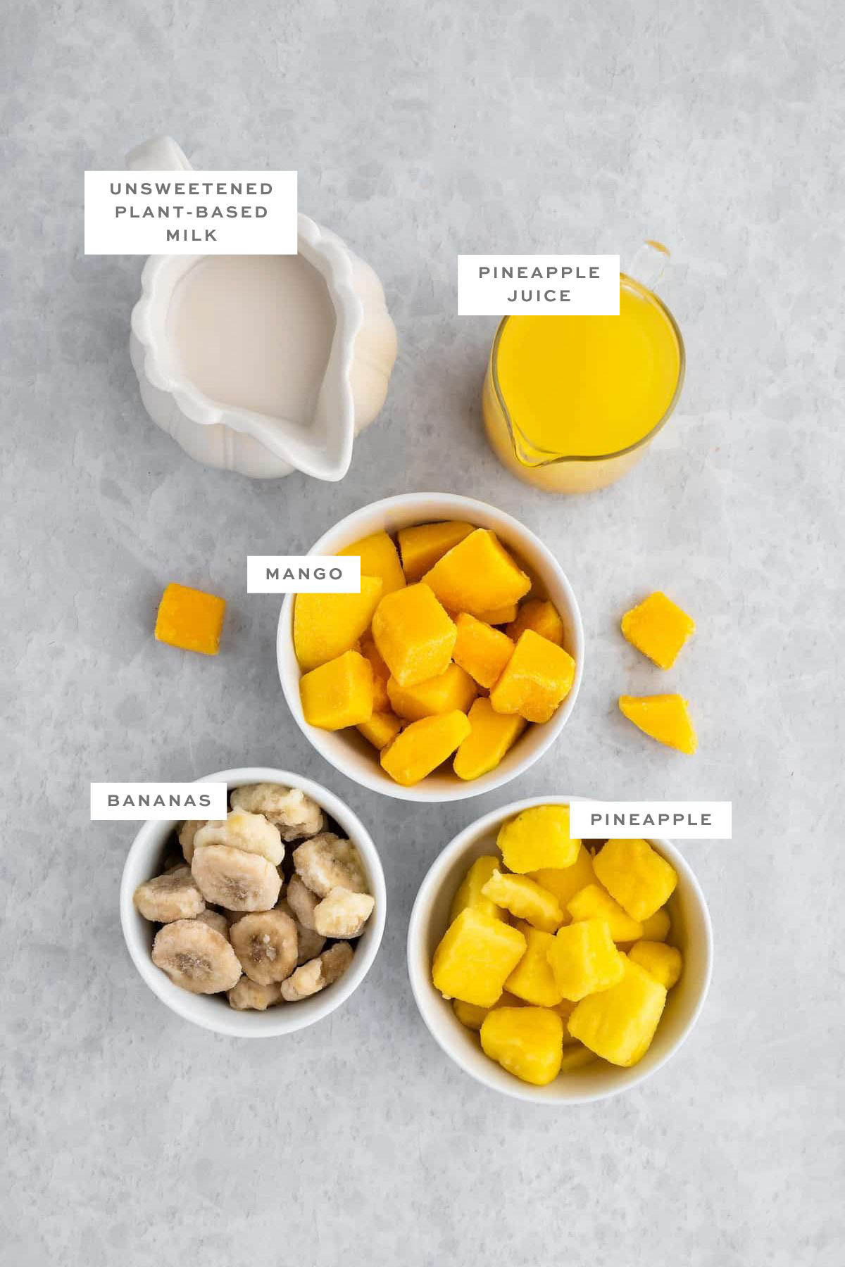 Ingredients for Mango-pineapple smoothie with labels.