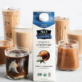 So Delicious dairy-free coffee creamer carton beside several glasses of coffee drinks.