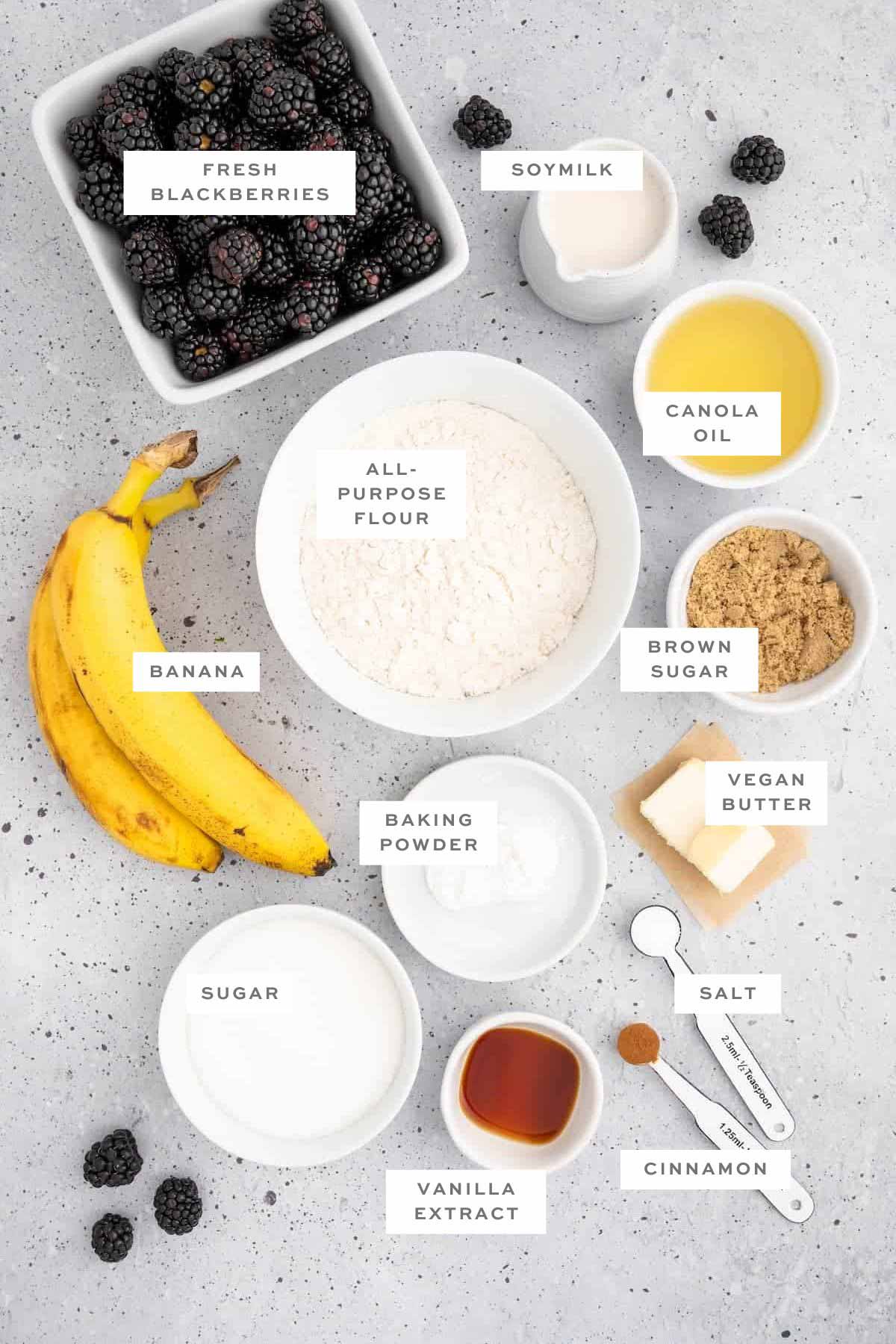 Ingredients for vegan blackberry muffins with labels.