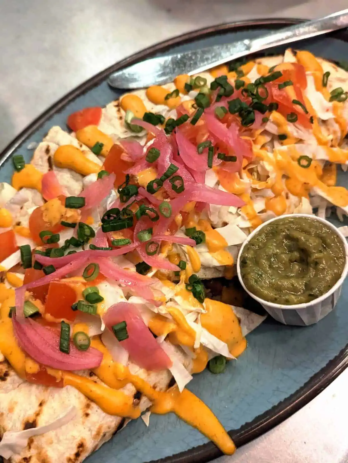 Vegan quesadillas served with guacamole.