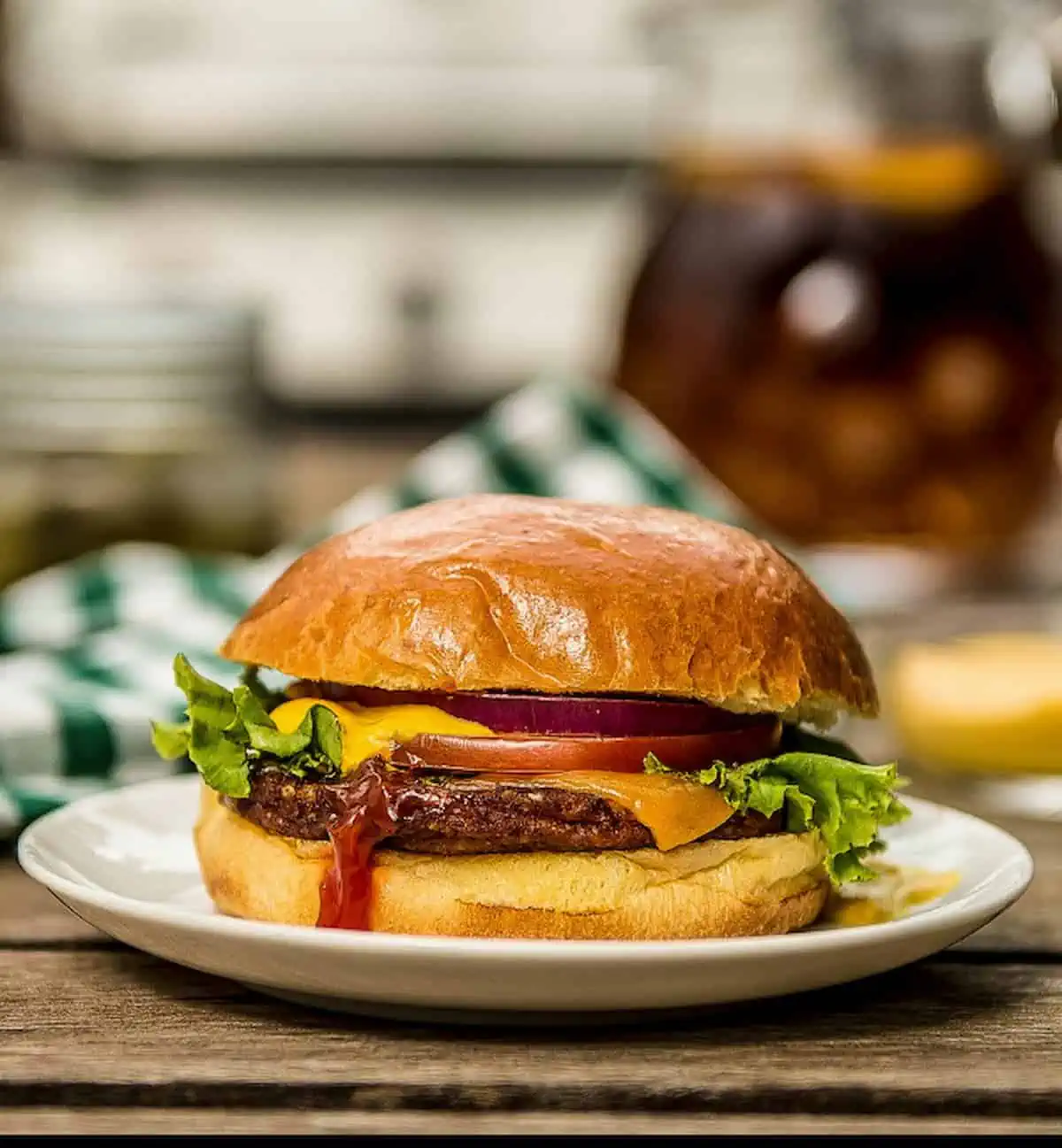 MorningStar Farms veggie burger in a burn with toppings, served on a plate.