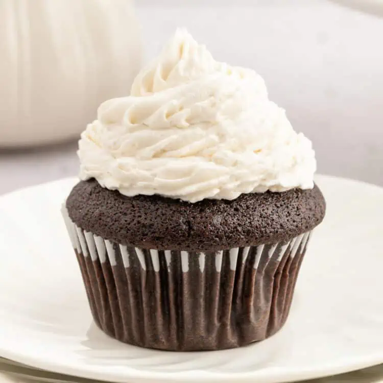 Vegan buttercream frosting on a chocolate cupcake.