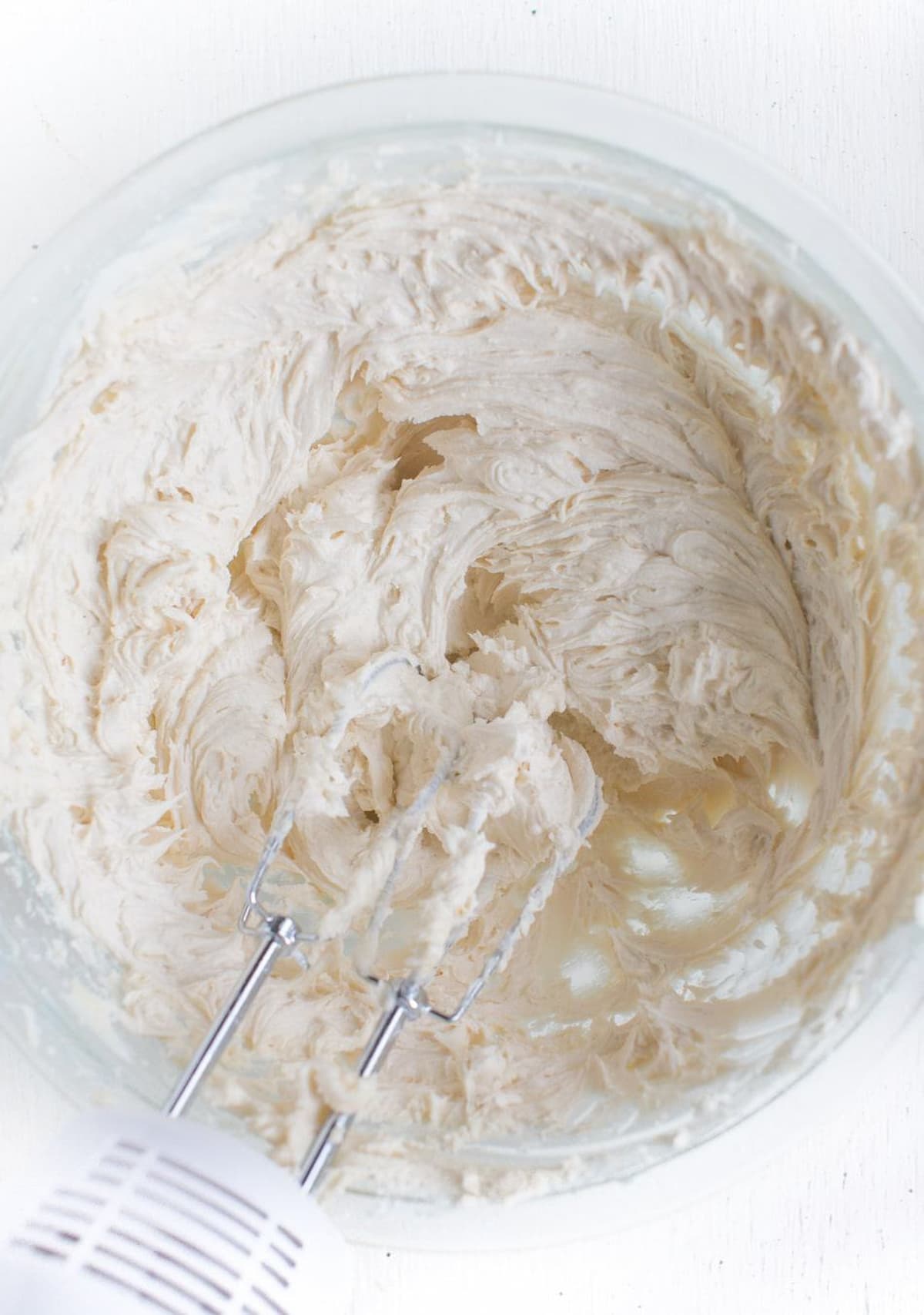 Vegan matcha buttercream mixed in a bowl.