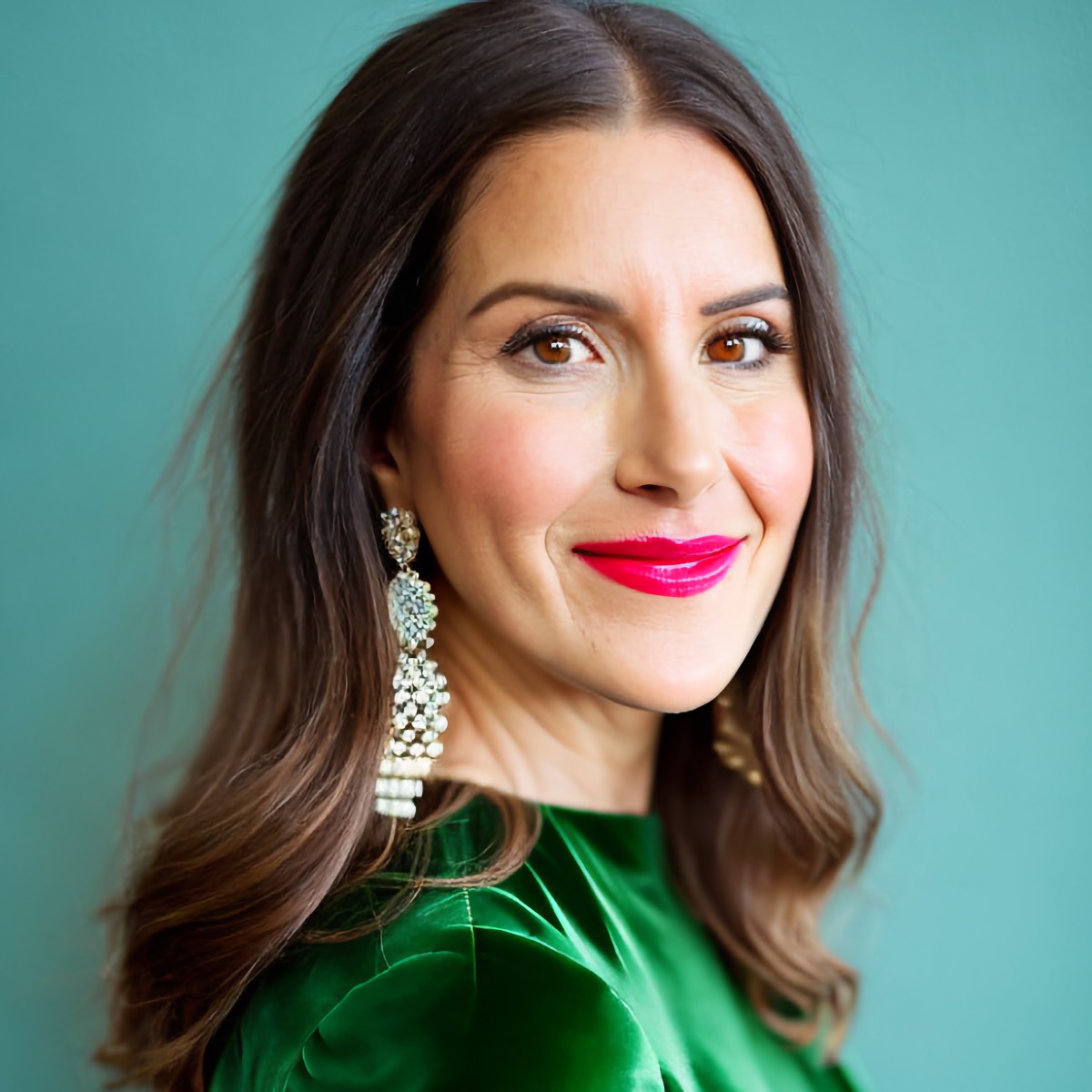 Headshot photo of Dr. Monica Davern vegan pediatrician in a green dress. 