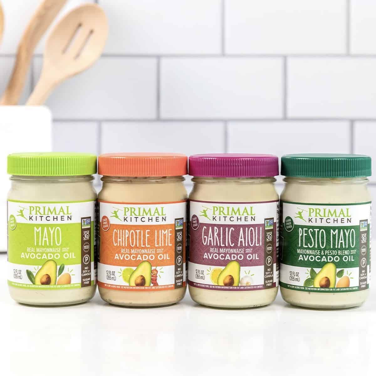 Four jars of colorful Primal Kitchen brand mayo that's egg-free, dairy-free, and plant-based. 