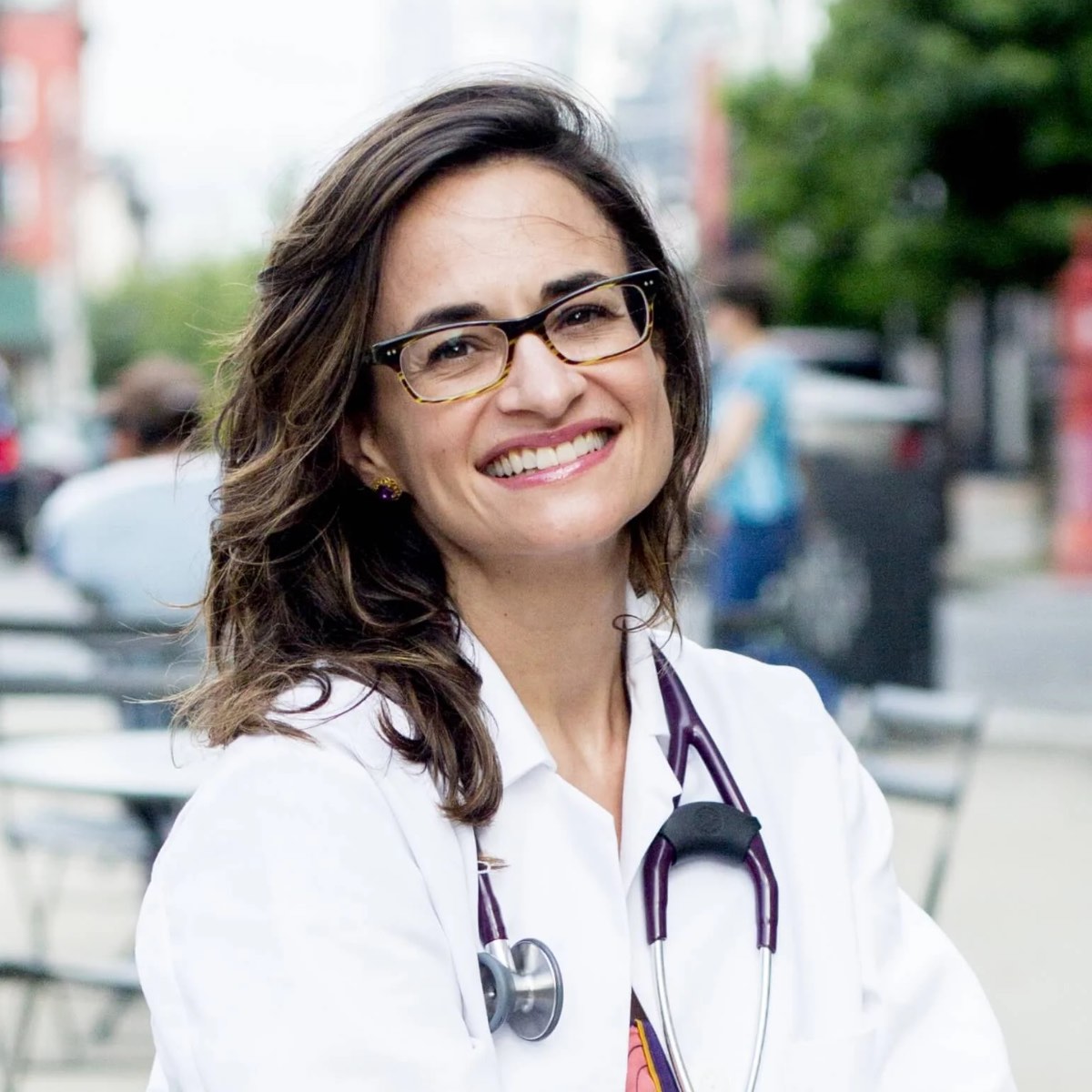 Headshot photo of Dr. Michelle McMacken in a doctor's coat with a stethoscope. 