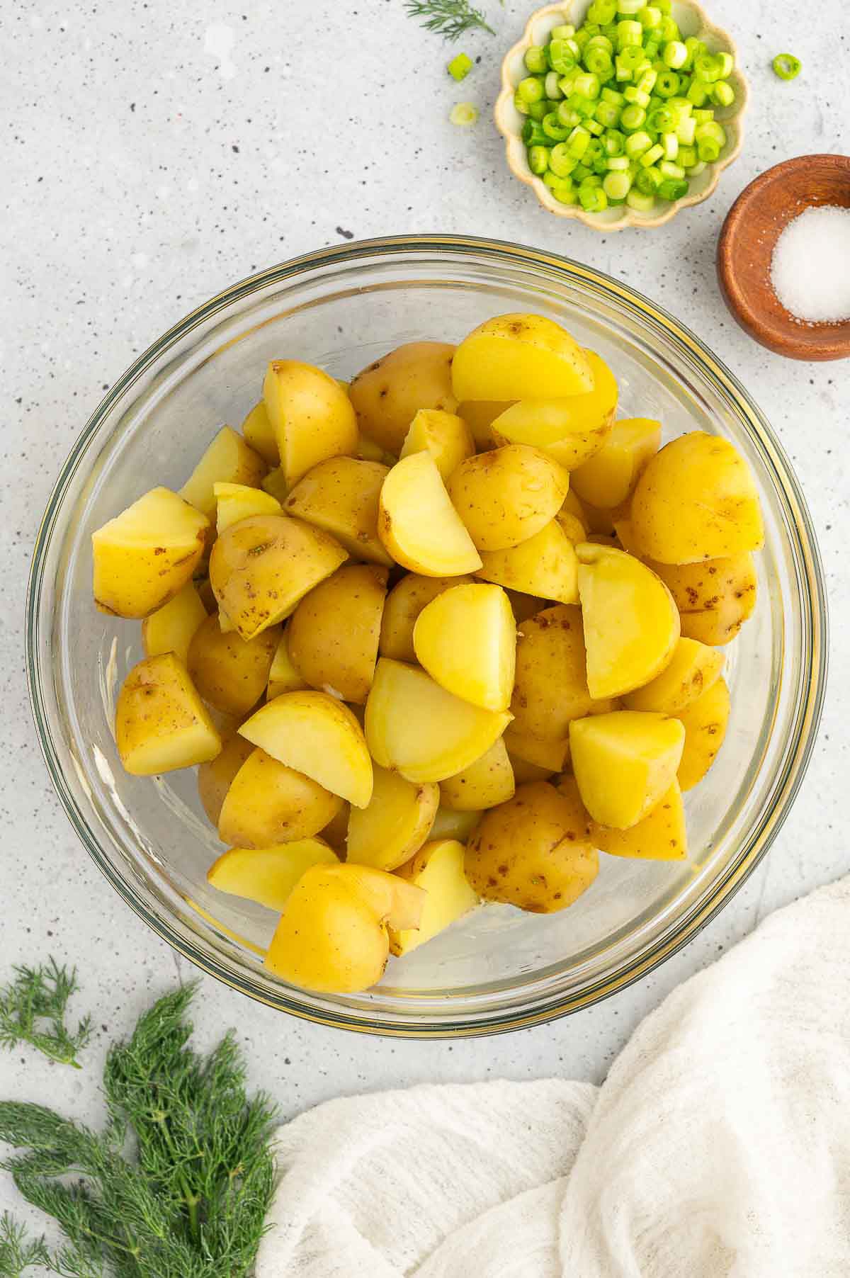 Cut potatoes in a bowl.