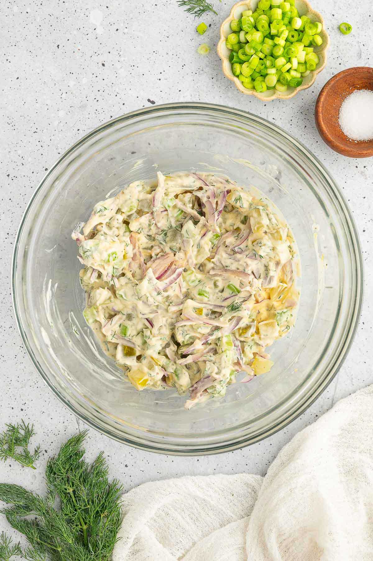 Dressing for vegan potato salad mixed together in a bowl.