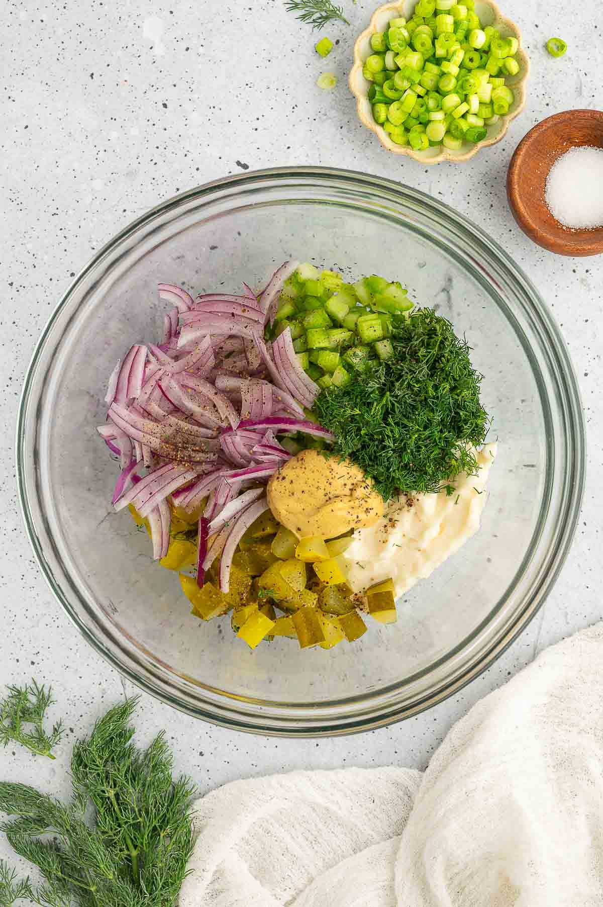Dressing ingredients for vegan potato salad in a bowl.