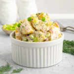 Vegan potato salad in a ramekin.