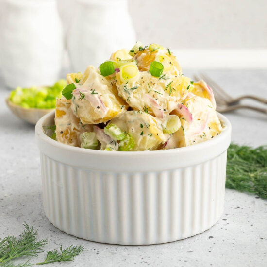 Vegan potato salad in a ramekin.