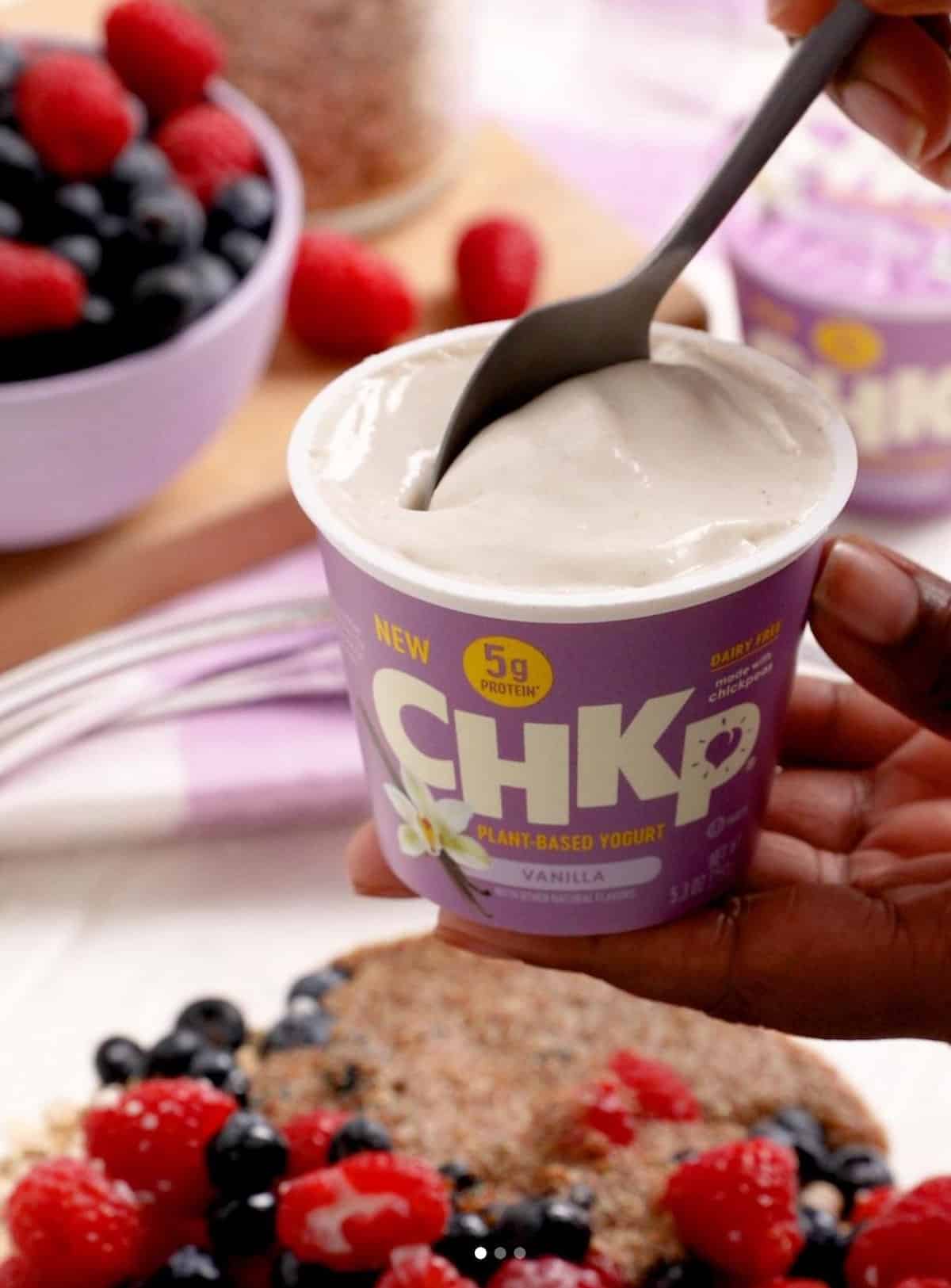 A container of Chkp Foods brand vegan vanilla yogurt.