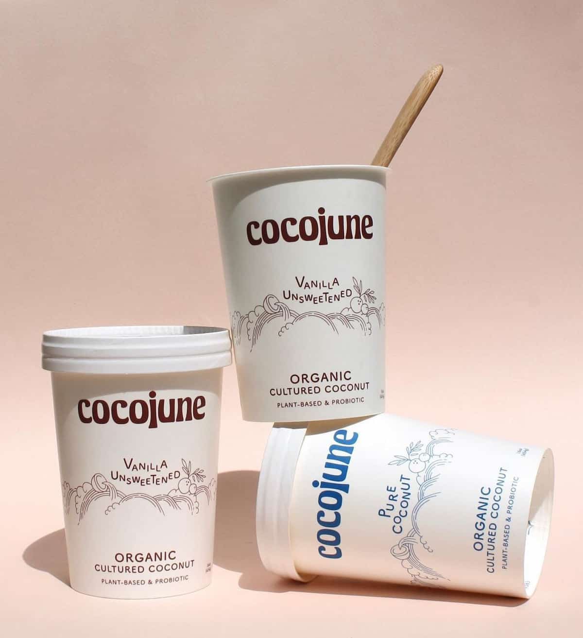 Three containers of Cocojune vegan yogurt.