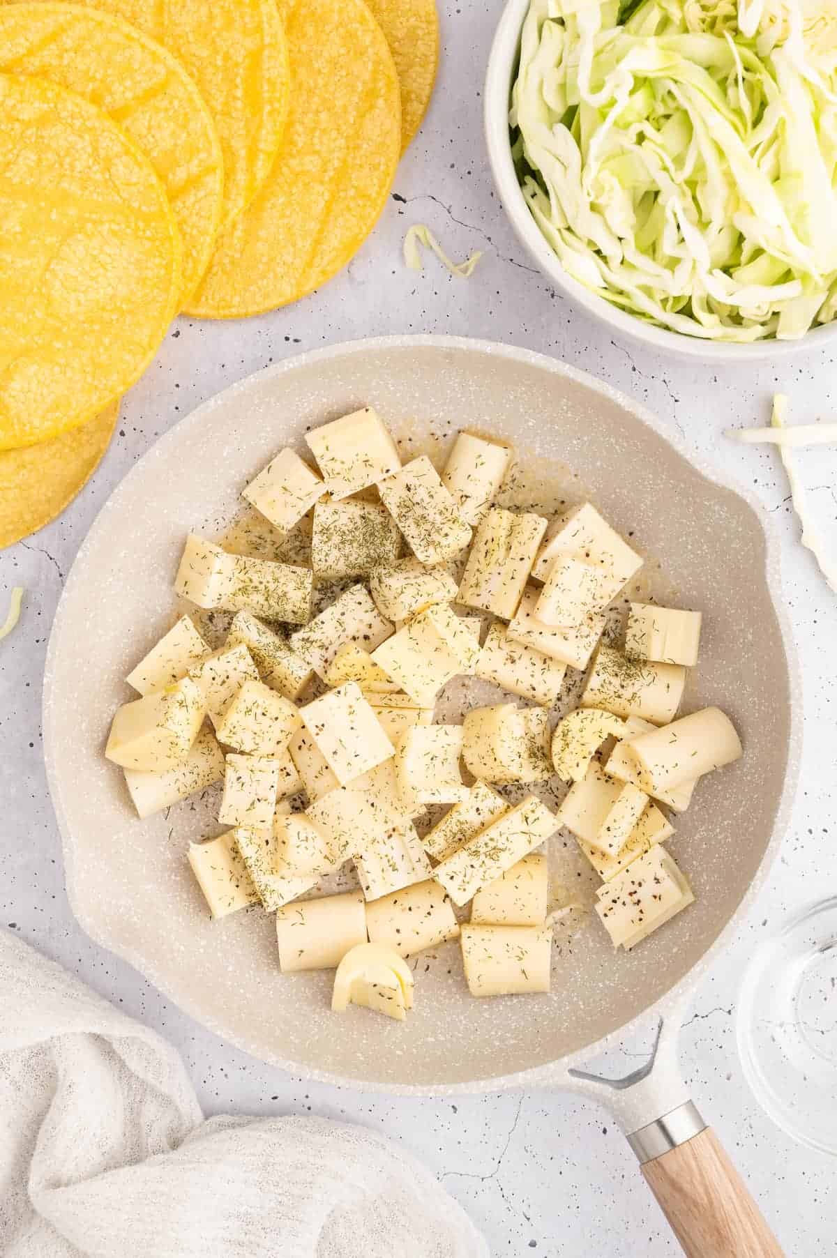 Chopped hearts of palm in a skillet.