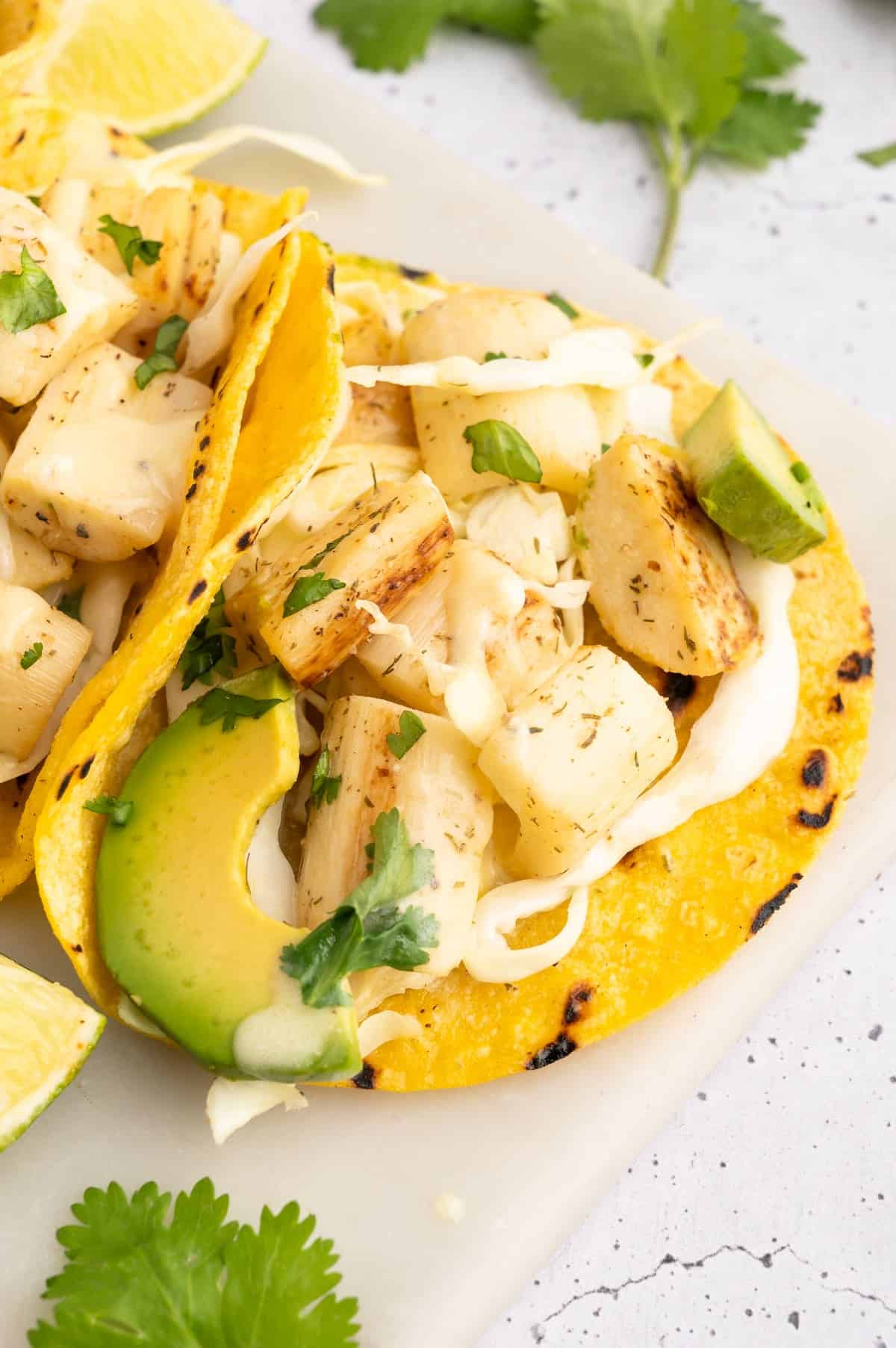 A vegan fish taco on a plate.