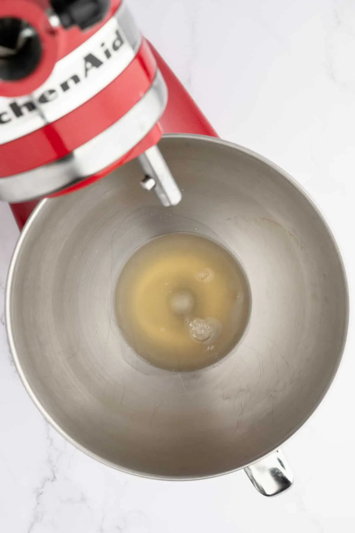 Aquafaba in a stand mixer bowl.