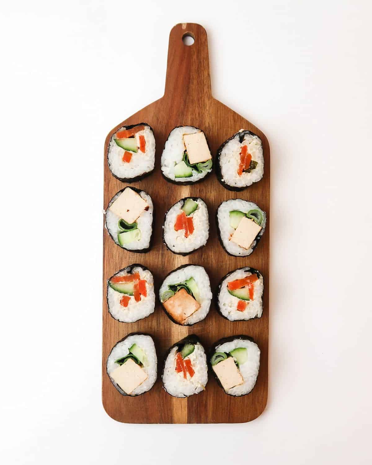 Sushi filled with carrot lox and tofu.