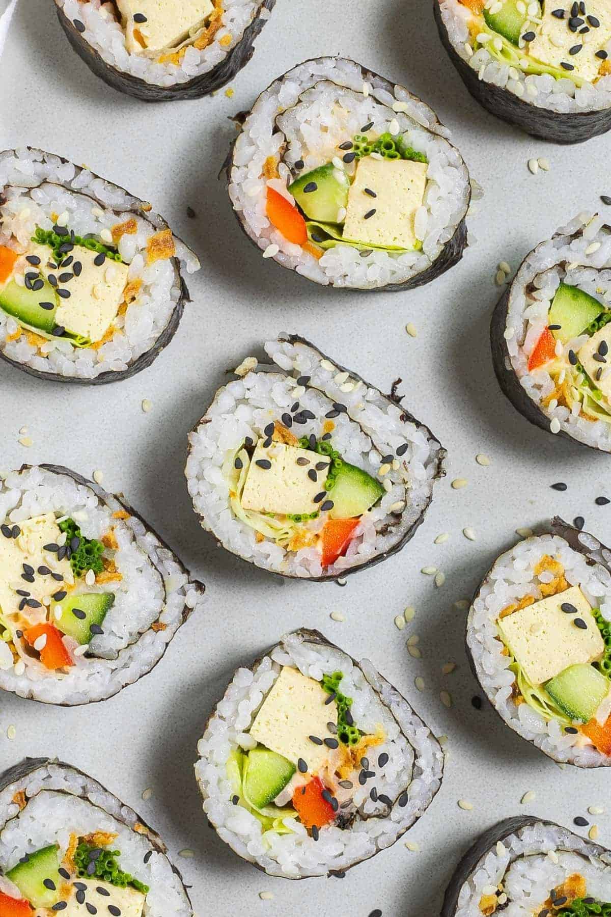 An arrangement of tofu and vegetable rolls.