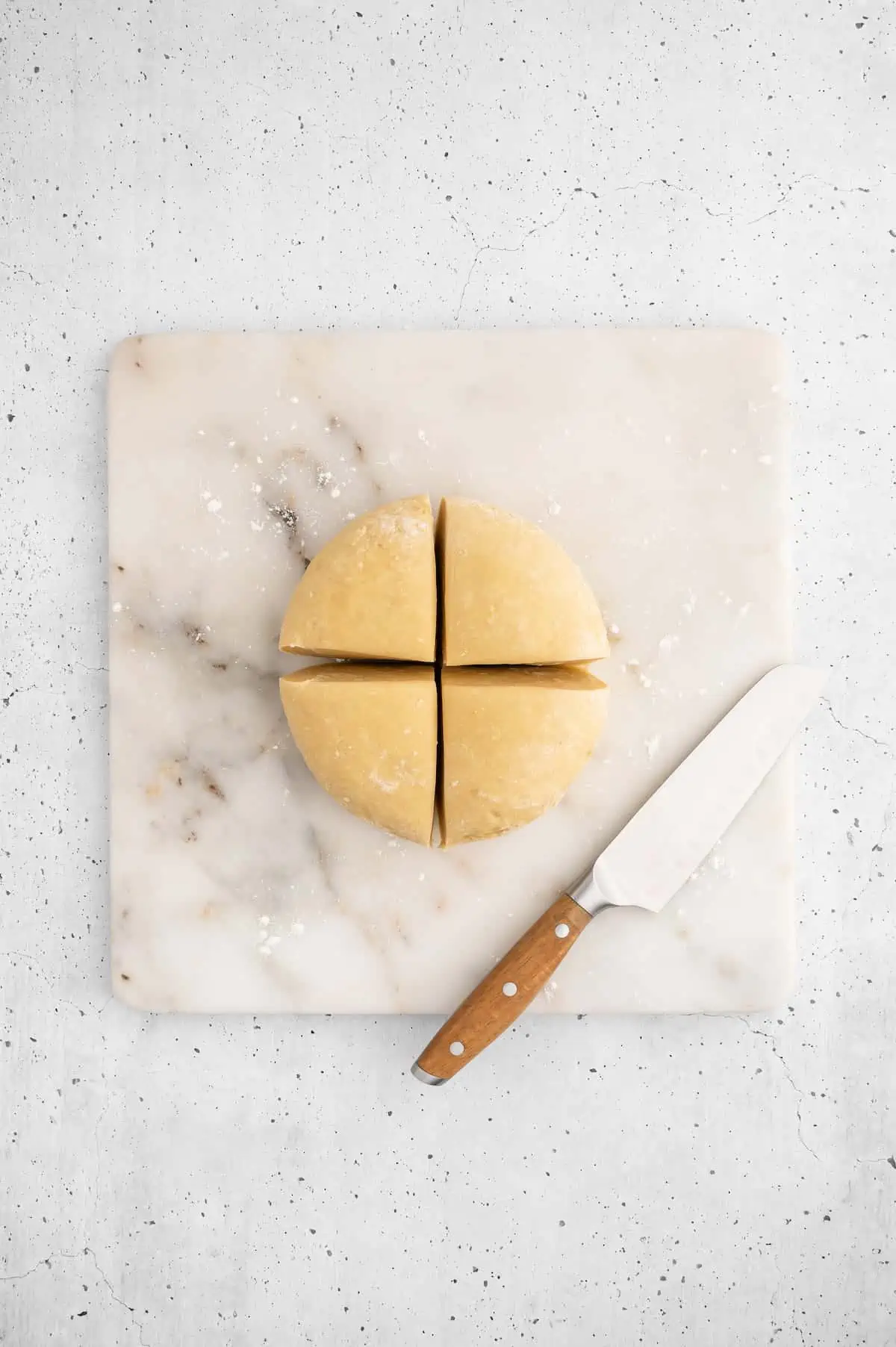 Vegan ravioli dough, cut into quarters.