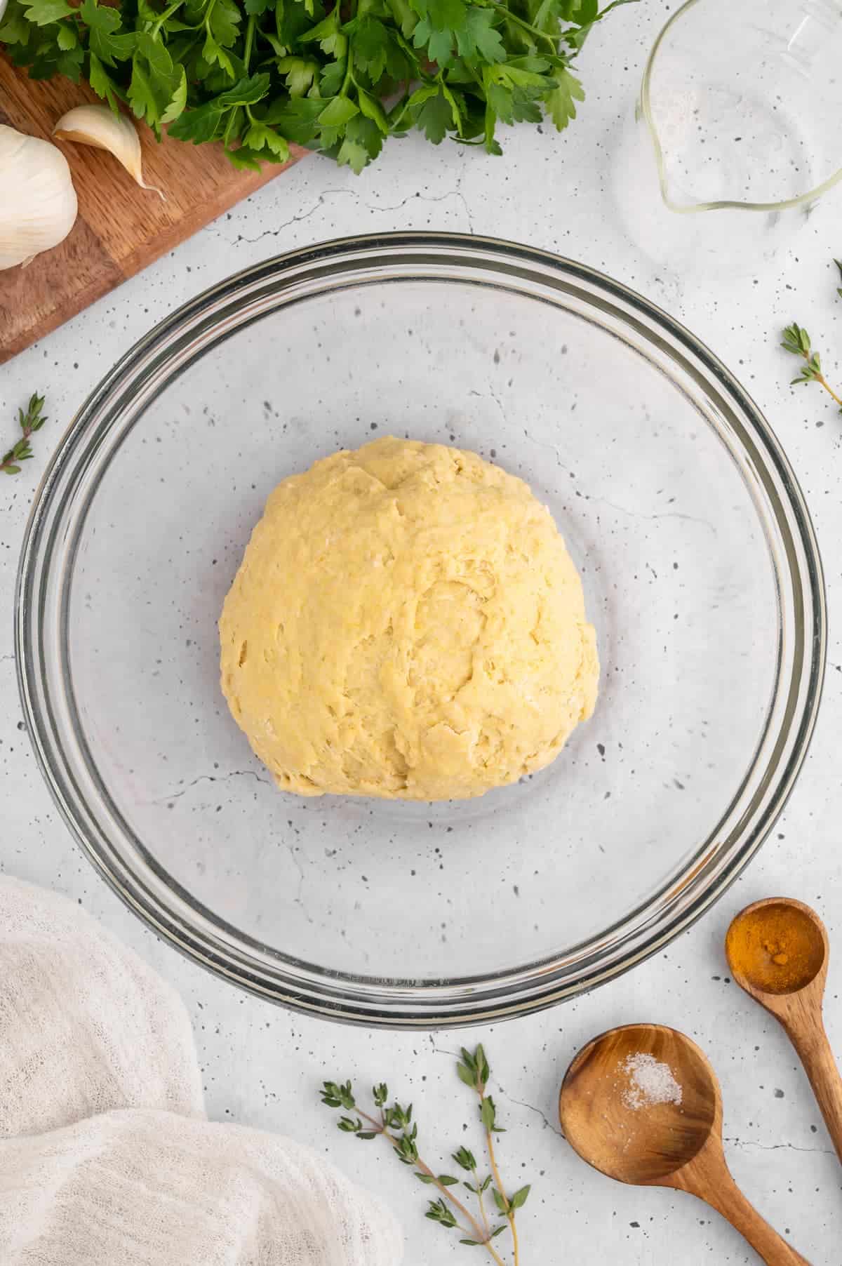 Vegan ravioli dough in a glass bowl.