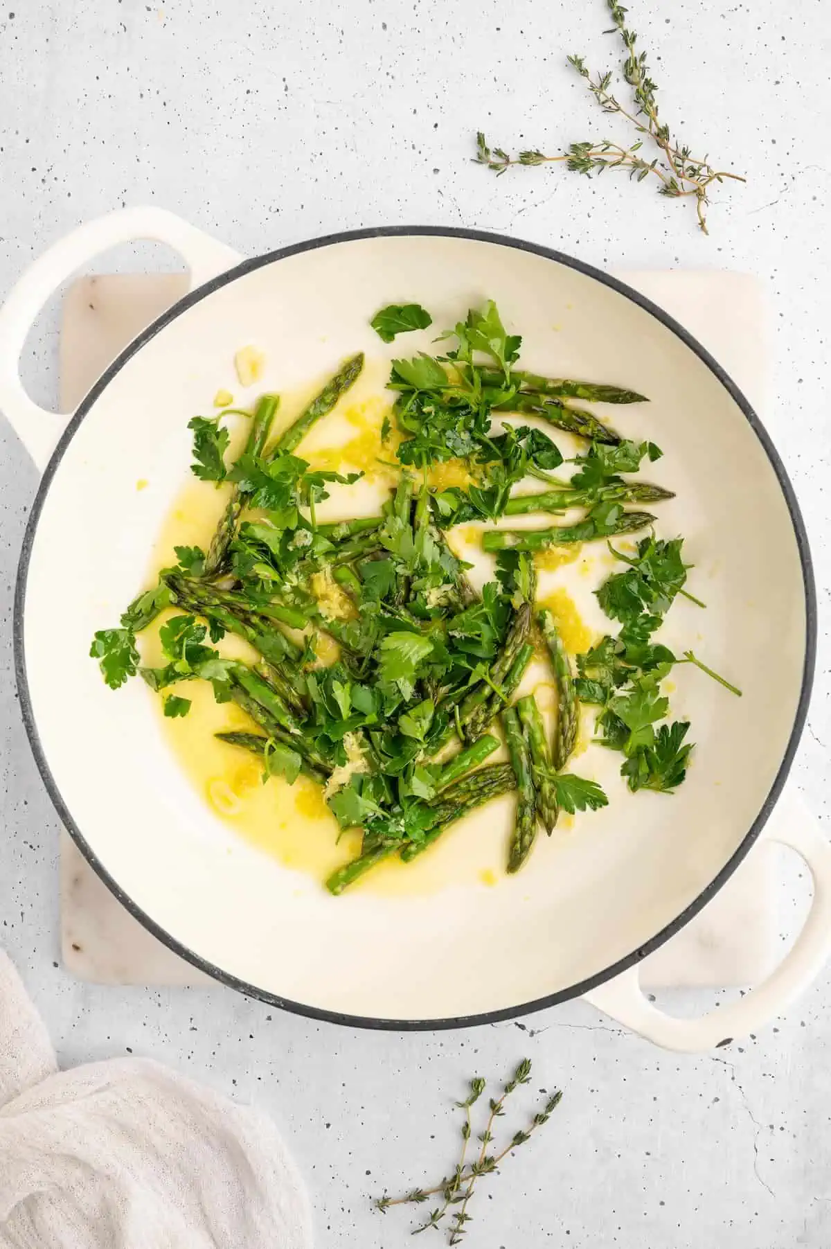 Asparagus and garlic in a sauté pan.